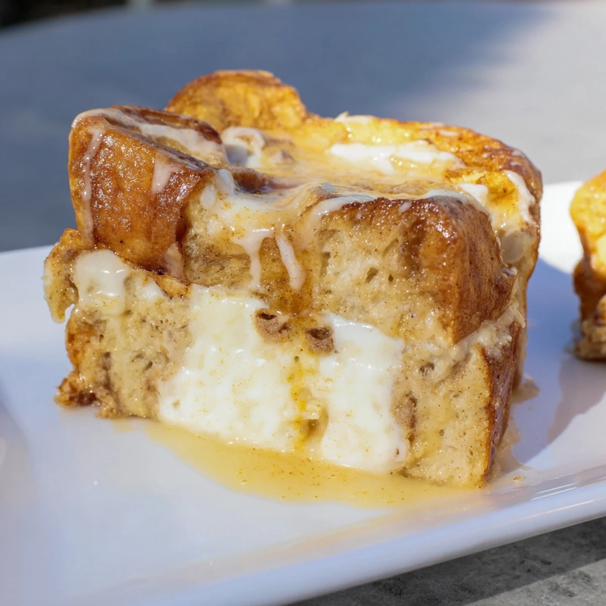 Steaming-hot Soft Spice Baked French Toast Casserole, topped with a sweet glaze and fresh berries.