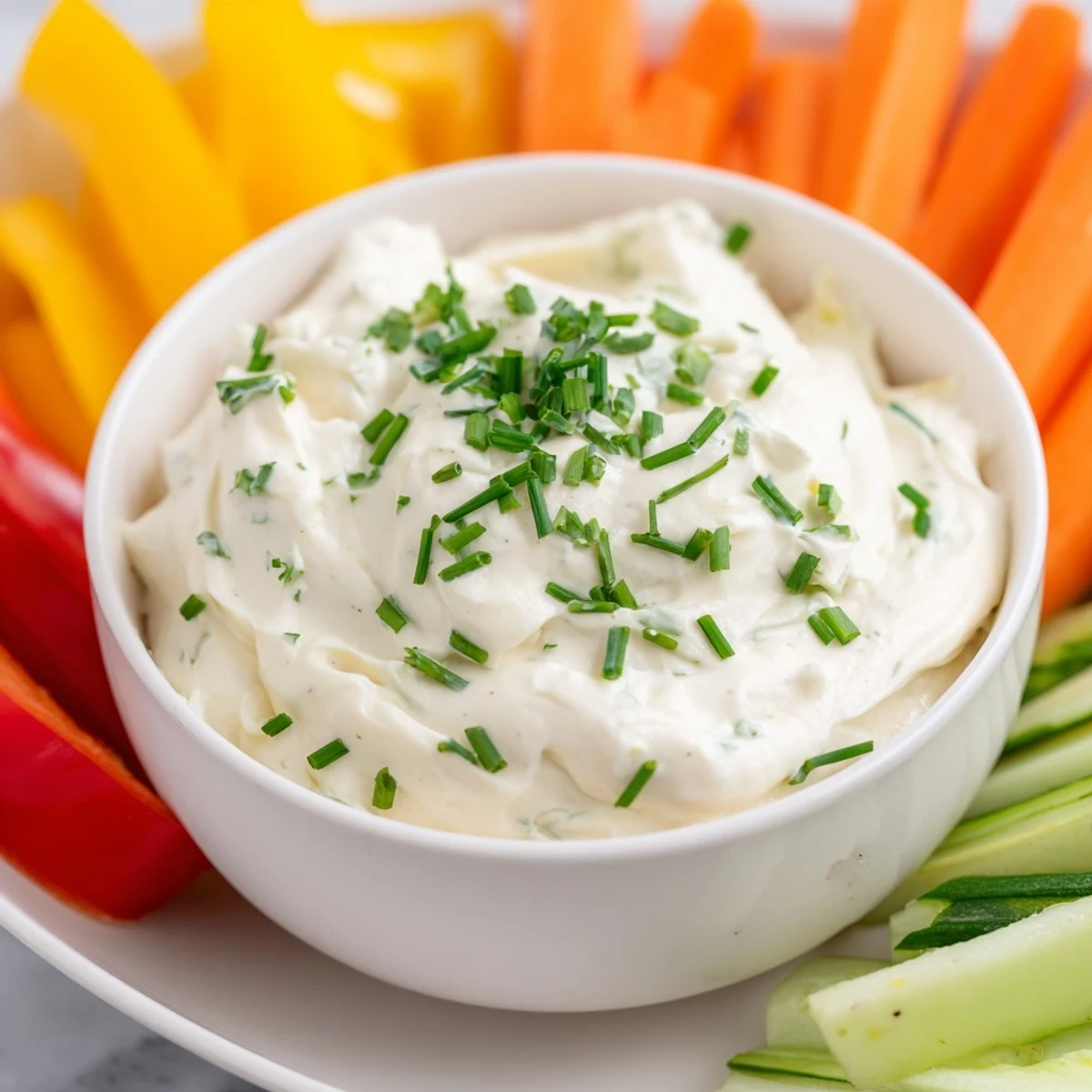 Vibrant image of Kids Dip: Cream Cheese and Ranch Dip, surrounded by colorful, crunchy veggie sticks.