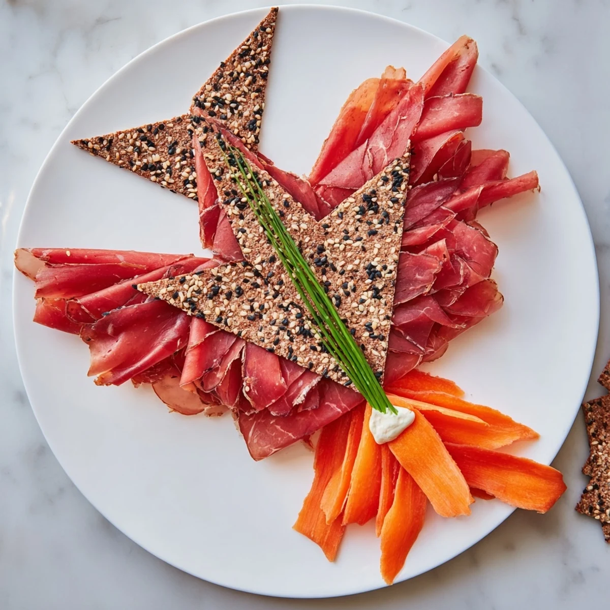 Delicate Paper Crane appetizer, featuring prosciutto and crackers, ready to serve and enjoy.