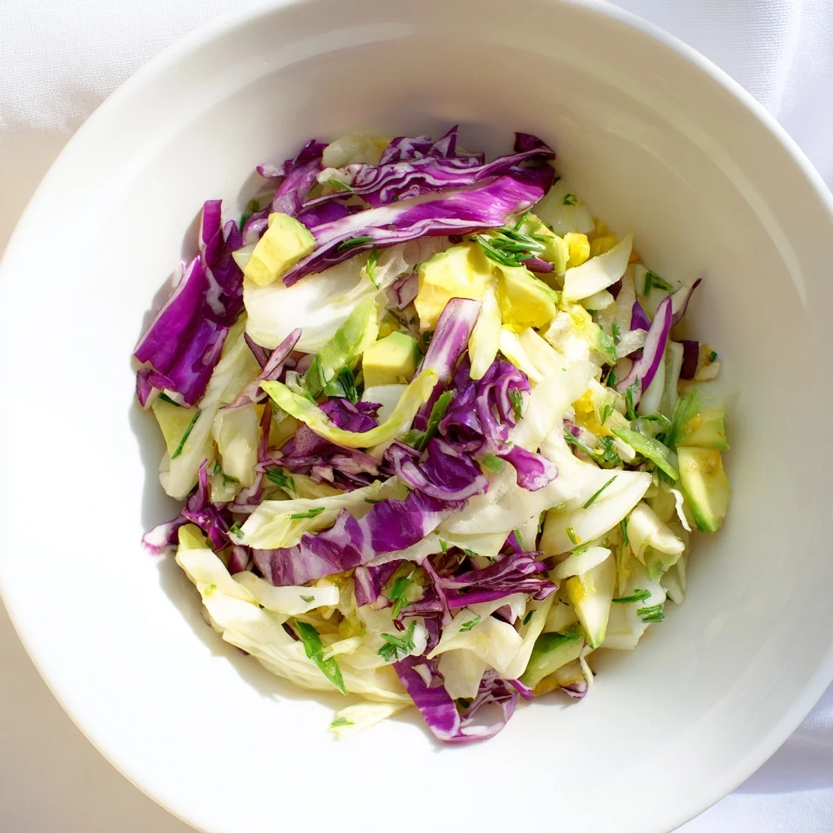 Vibrant Green Goddess Detox Cabbage Salad with crisp veggies and a tangy lemon dressing, ready to enjoy.