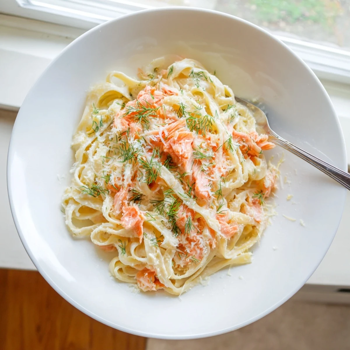 Creamy Salmon Pasta features hot-smoked salmon and fresh dill tossed in a silky lemon-cream sauce with al dente fettuccine.  