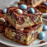 Soft, chewy cookie bars with Cadbury mini eggs and pastel M&Ms, perfect for spring celebrations and Easter dessert tables.