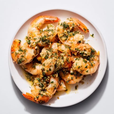 Light & Bright Lemon Herb Shrimp Scampi, beautifully plated, with glistening shrimp and vibrant herbs.