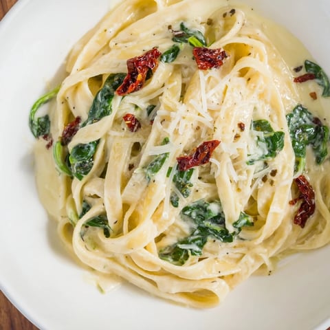 One-Pot Creamy Tuscan Garlic Herb Pasta, a warm bowl of creamy, herb-infused pasta; a perfect meal.
