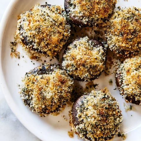 Golden brown Ranch-Seasoned Crispy Mushrooms fresh from the oven, ready to be served with dipping sauce.