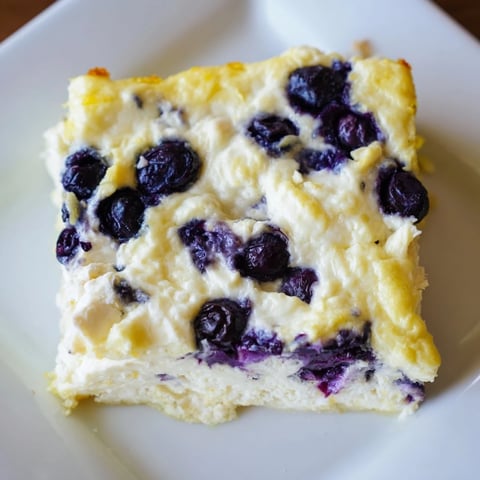 Golden-brown Blueberry Cottage Cheese Bake, baked to perfection with juicy blueberries, ready to serve.