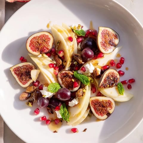 This Fig and Date Snowdrift Platter showcases festive halved figs and dates, ready for a holiday dessert.