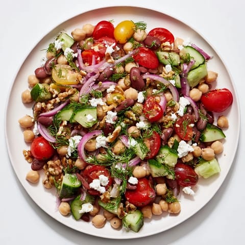 A close-up view of the Dense Bean Salad, featuring colorful veggies and herbed dressing.