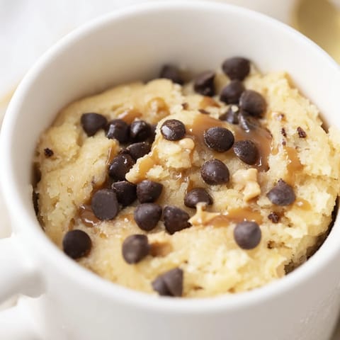 Fluffy and golden 2-Minute Peanut Butter Mug Cake, ready to enjoy straight from the mug after microwaving.