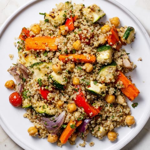 Imagine a hearty Quinoa Power Salad with colorful roasted vegetables and fresh parsley sprinkled on top.