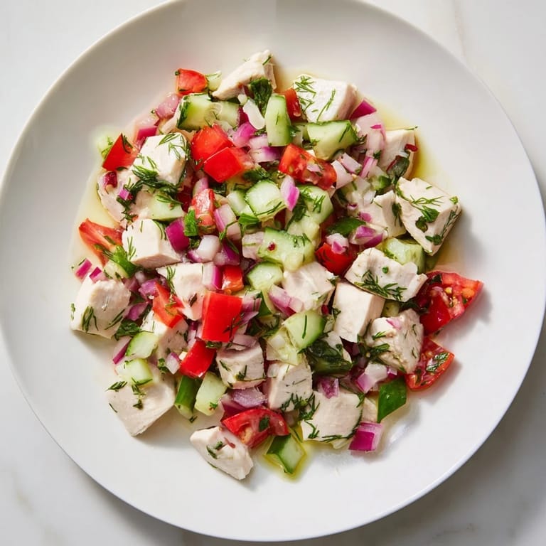 A close-up of a refreshing Cucumber and Chicken Clean Shaker with vibrant vegetables and tender chicken.