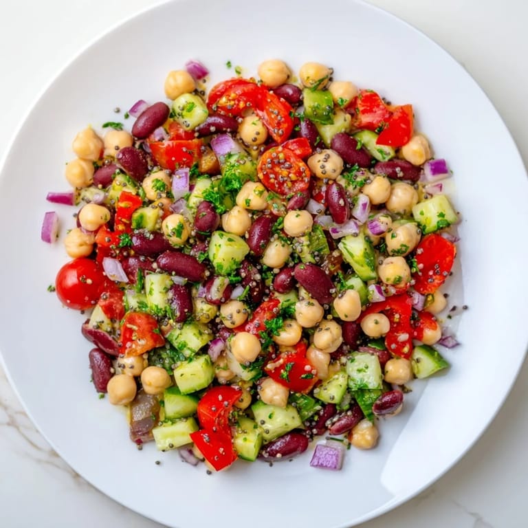 Colorful Dense Bean Salad with Wellness Seeds, showcasing chickpeas, beans, and fresh ingredients.