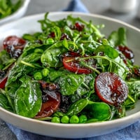 Bright Lemon Vinaigrette Spring Salad with Radishes and Peas, a crisp and colorful medley of greens, peas, and radishes in a zesty lemon dressing.