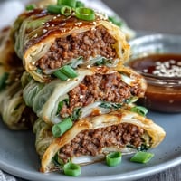 Savory Korean cabbage rolls filled with spicy ground beef and steamed to tender perfection.